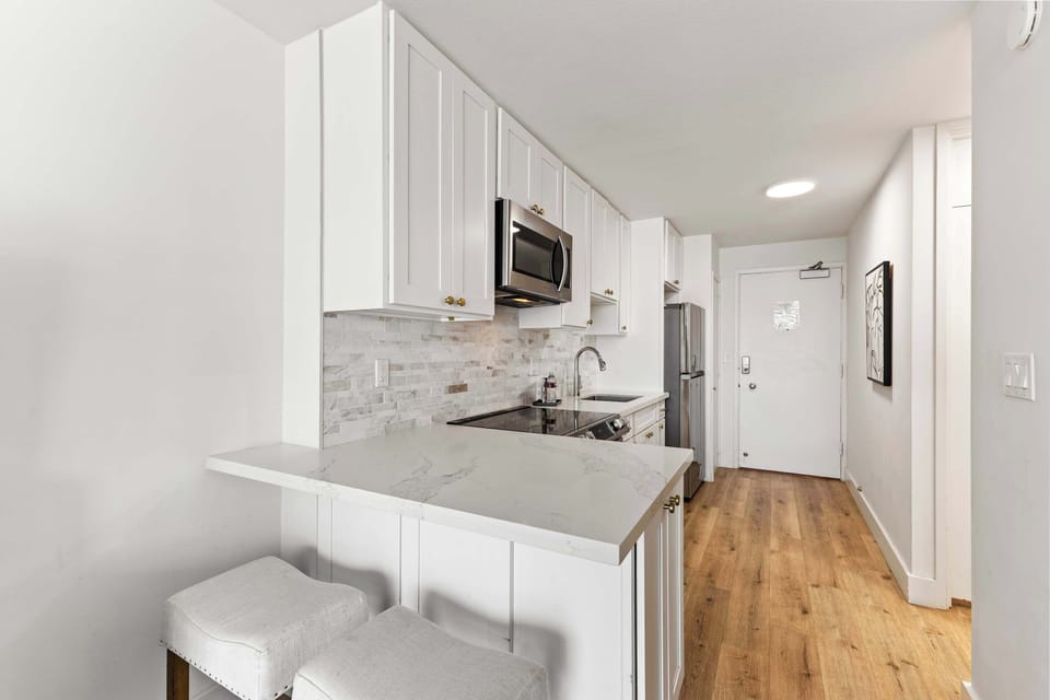 Stylish and functional with quartz countertops, full-size appliances, and everything you need to cook at home