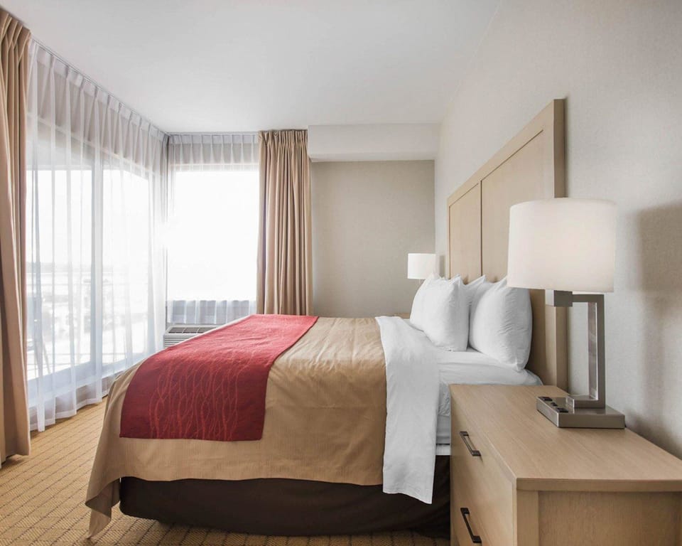 Desk, blackout drapes, iron/ironing board, rollaway beds