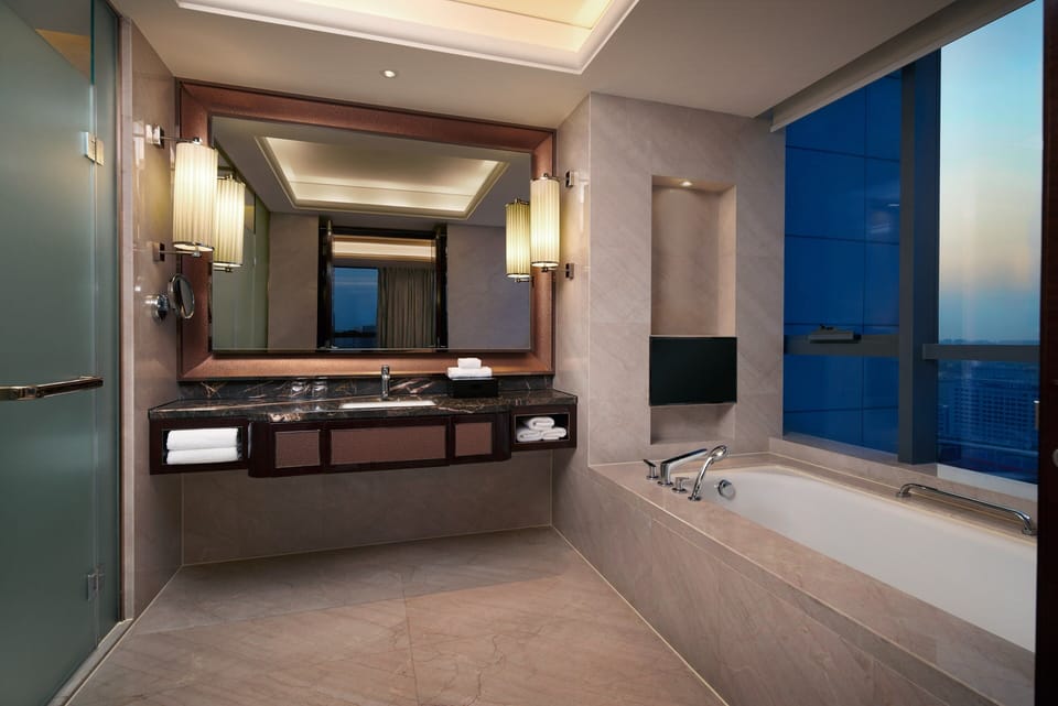 Separate tub and shower, rainfall showerhead, free toiletries
