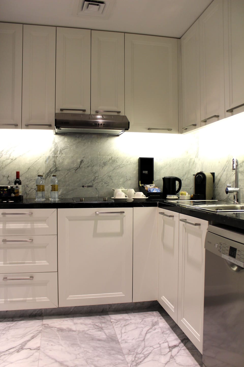 Luxury Suite, 1 King Bed | Private kitchenette | Coffee/tea maker, highchair