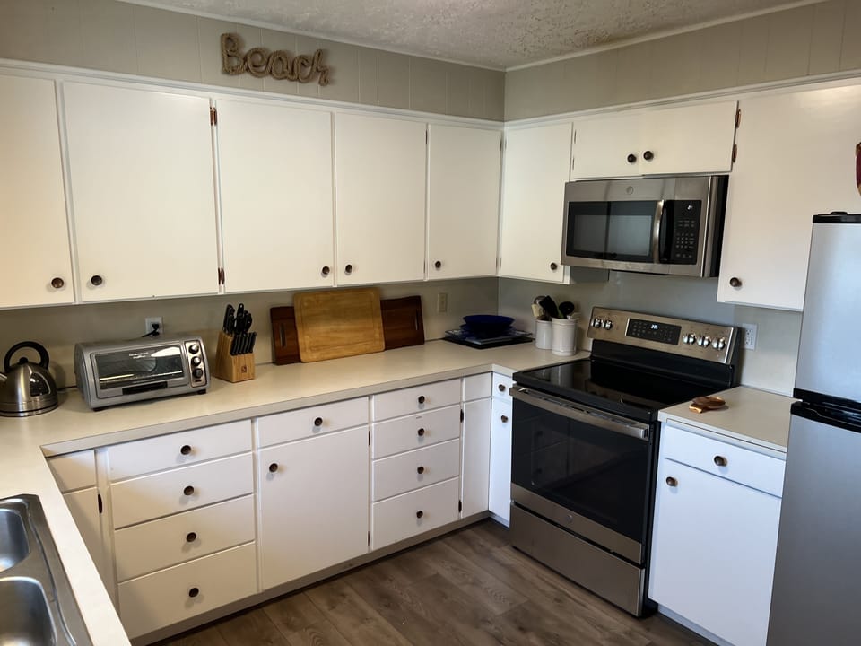 Toaster, microwave, coffee maker, electric kettle, new electric range.