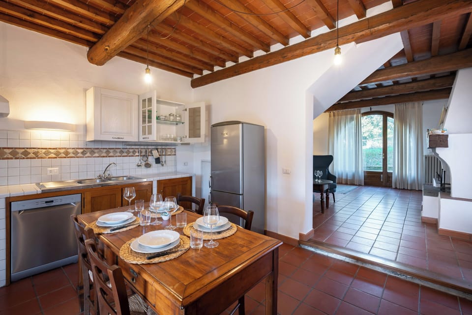 Deluxe Apartment | Private kitchen | Fridge, highchair, cookware/dishes/utensils, cleaning supplies
