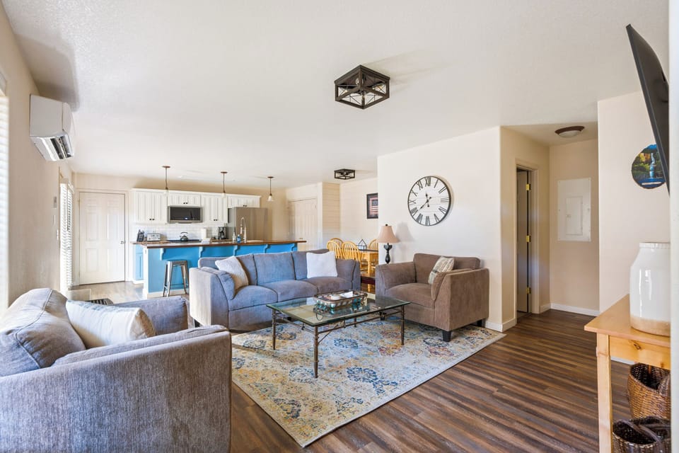 Relax in your spacious living room with plush seating and modern kitchen, perfect for unwinding after exploring.