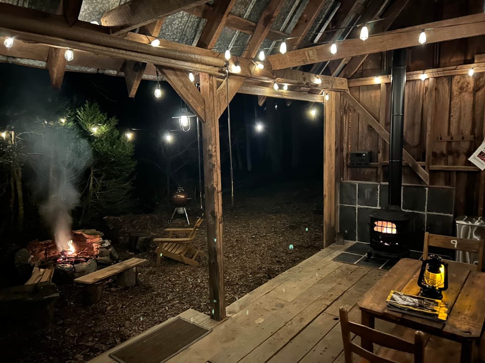 Wood stove inside, roaring fire outside