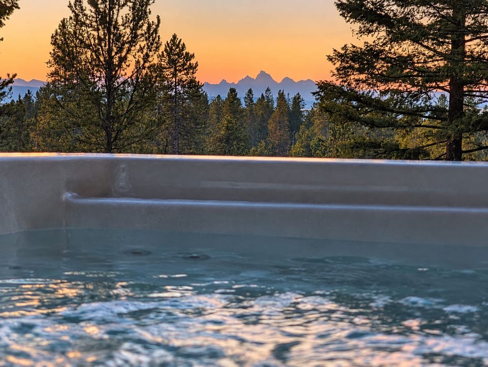 a view of the Grand Tetons at sunrise from the Hottub 
