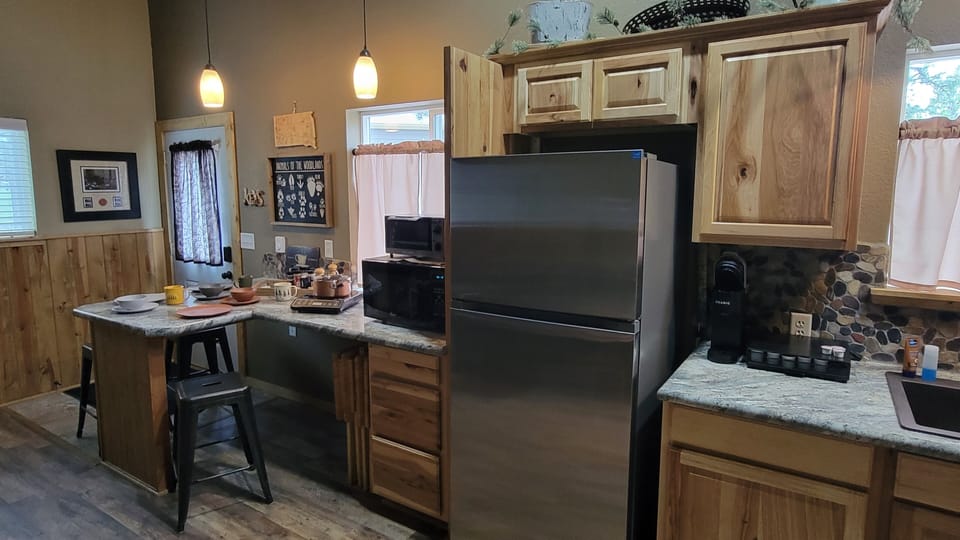 This is your breakfast bar area with a single cup and full coffee maker below.