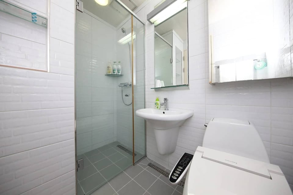 Shower, free toiletries, slippers, towels