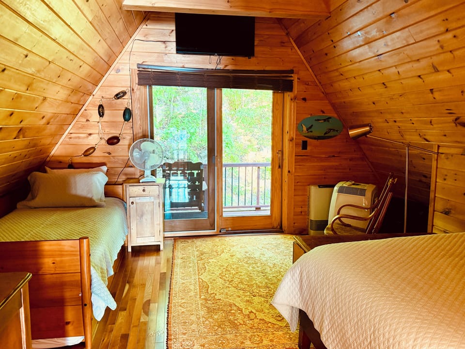 Bedroom 2 on 2nd floor: queen bed, single bed and trundle bed. Private balcony