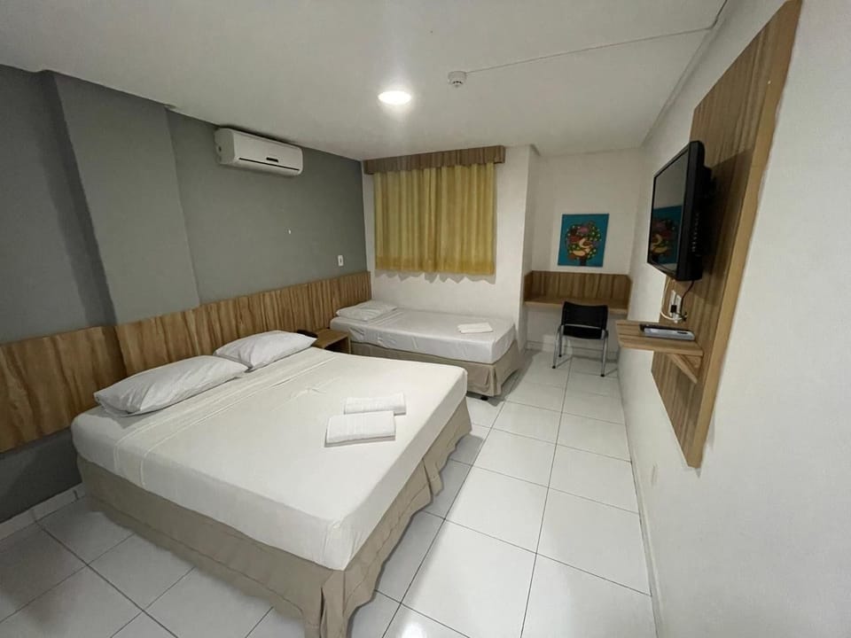 Deluxe Triple Room | Iron/ironing board (on request), WiFi (free), bed sheets