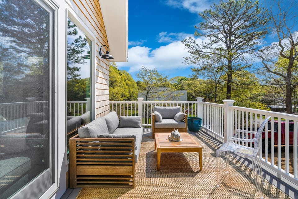 Outdoor deck with seating and dining plus grill (2nd floor)