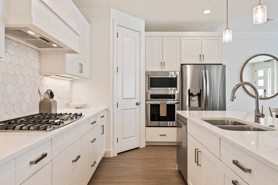 Townhome, 4 Bedrooms | Private kitchen | Fridge, oven, coffee/tea maker, toaster
