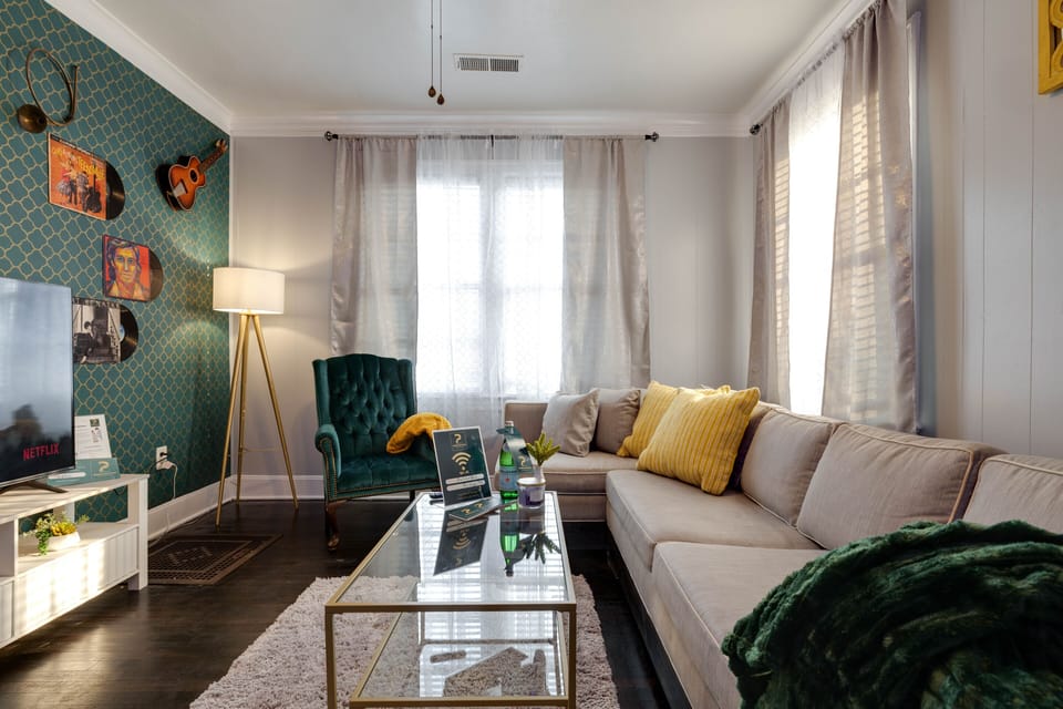 LIVING ROOM (music room) features 58 inches smart TV and a sleeper sofa