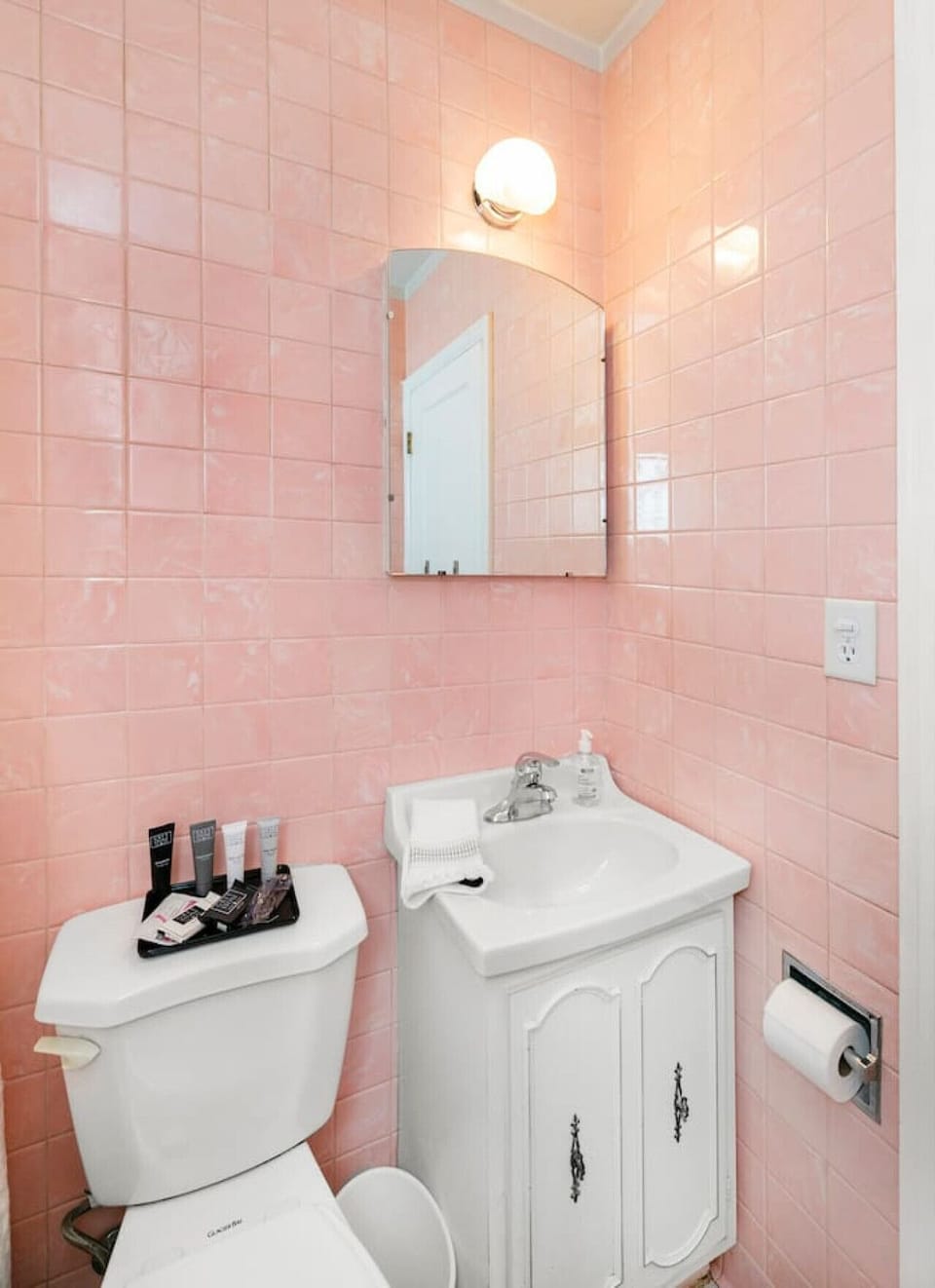 Staying true to it`s 1940`s roots, check out the awesome retro pink tile in the main floor bathroom! Groovy, baby!