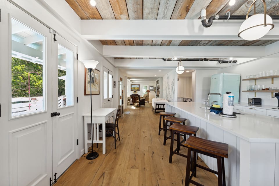 Open floor plan, view from dining area into kitchen and living room