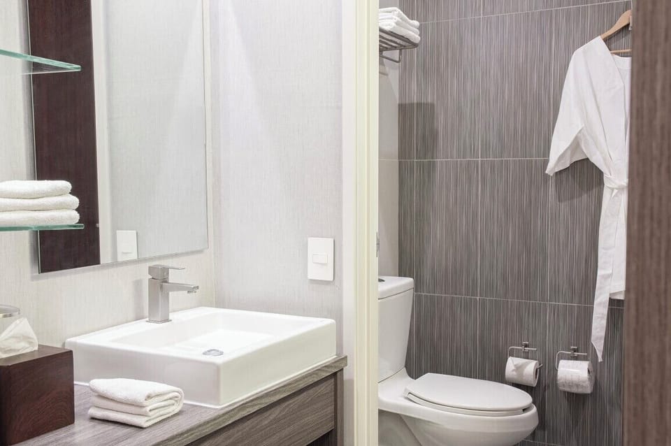 Designer toiletries, hair dryer, towels, soap