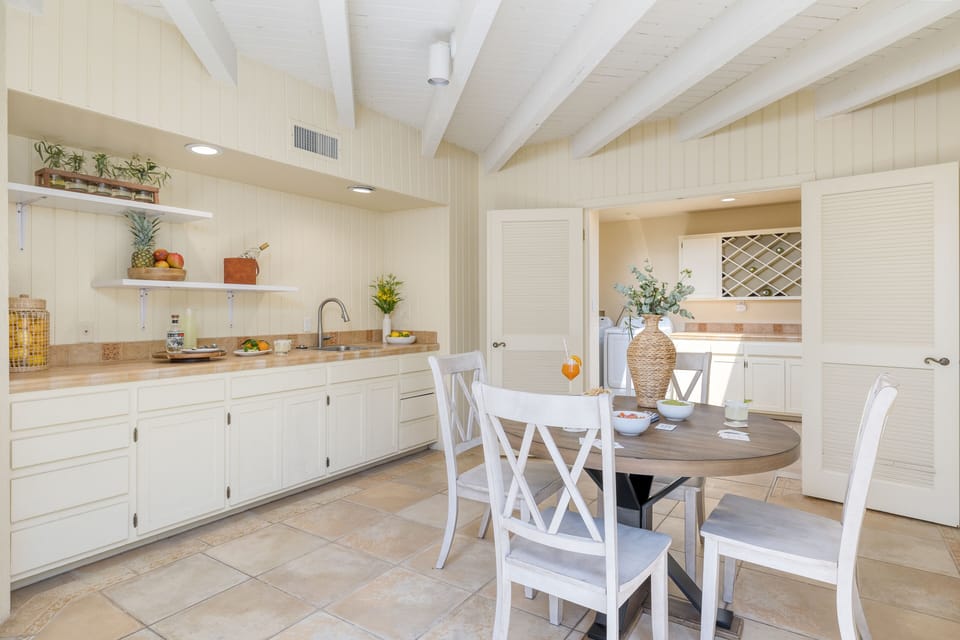 Additional prep and serving area near the kitchen provides extra space and a breakfast nook.