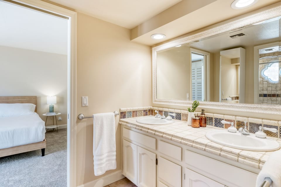 Jack-and-Jill bathroom between Bedrooms 2 and 3 features dual sinks and a shower/tub combo.
