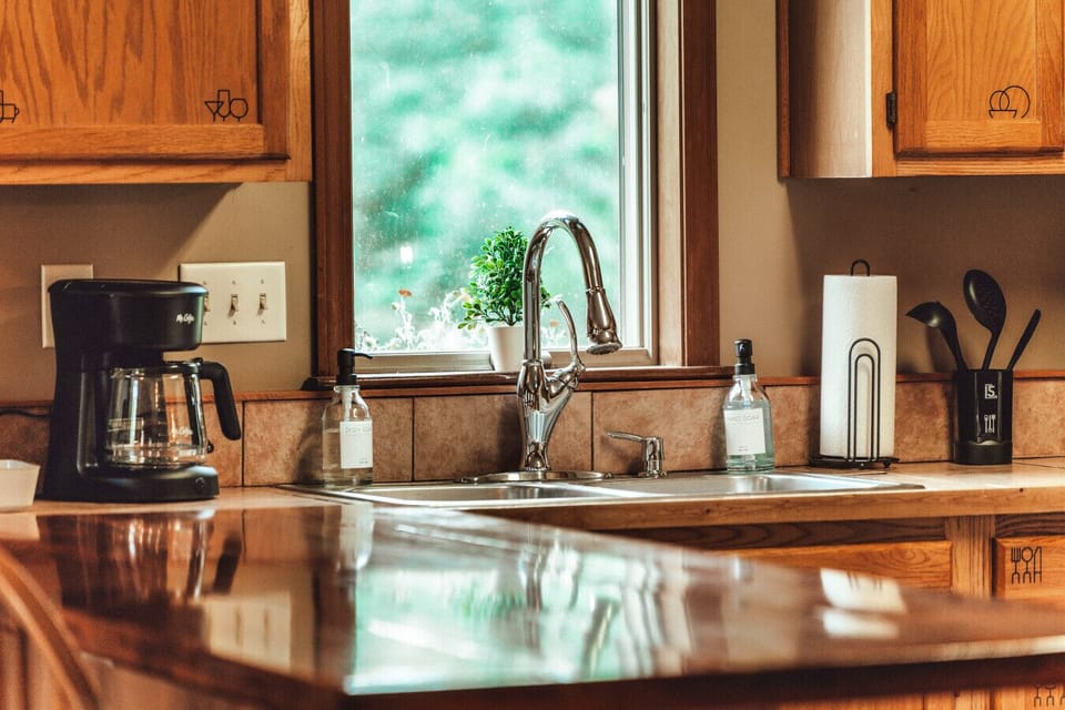 Bright sink and coffee setup create an easy morning routine before heading out for outdoor adventures
