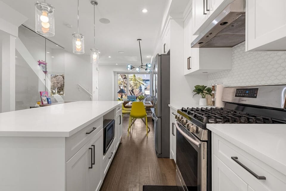 Contemporary kitchen with sleek finishes, full-size appliances, and generous prep space.