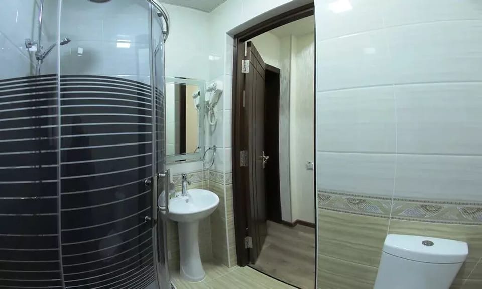 Standard Room | Bathroom | Hair dryer, slippers, towels