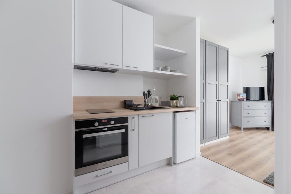 The fully equipped kitchenette includes everything you need for a home-cooked meal.