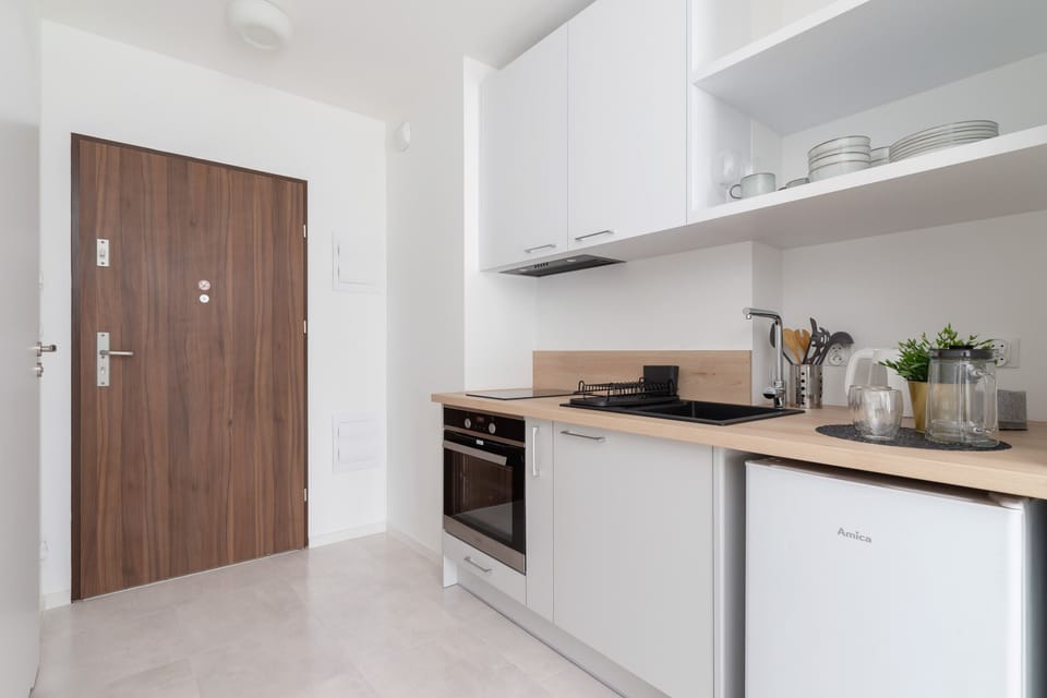 Cook and dine in style with the modern kitchenette and dining area.