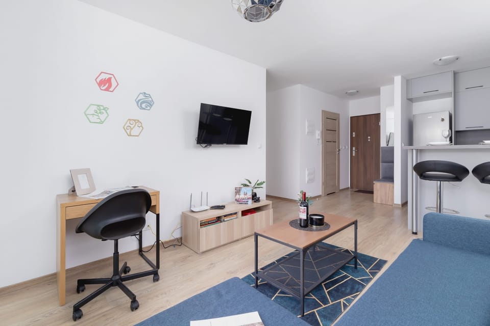 The elegant living room featuring a double sofa bed.