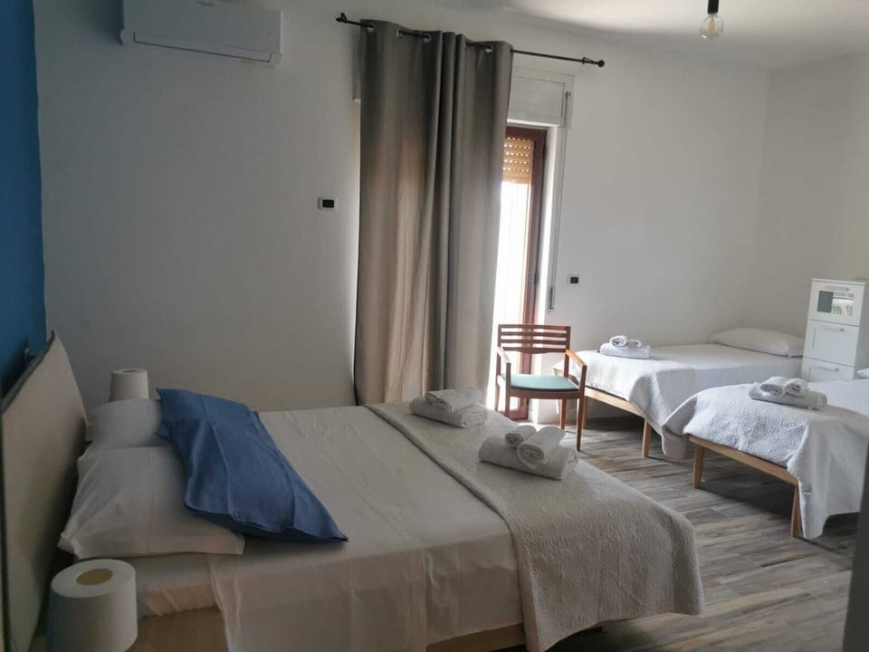Classic Quadruple Room | Pillowtop beds, travel crib, free WiFi
