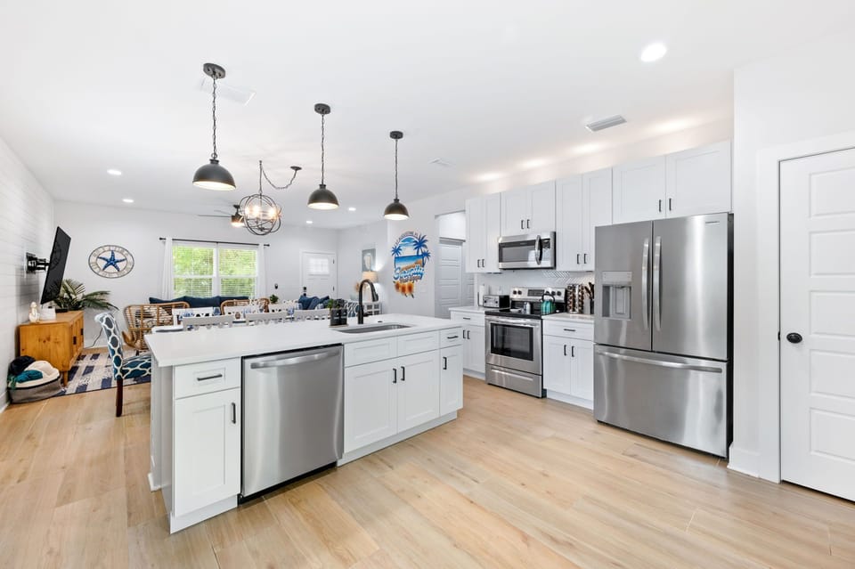 Well stocked kitchen with quartz countertops.  Spice rack, oil and cooking essentials .