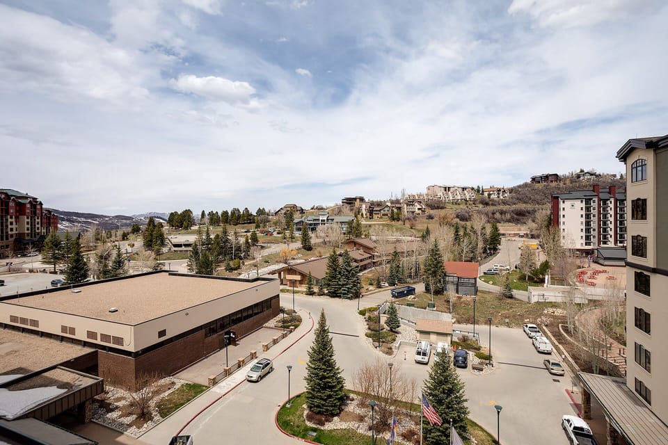Sweeping mountain town views showcase the charming neighborhood with rolling hills and peaceful residential streets surrounding the property.