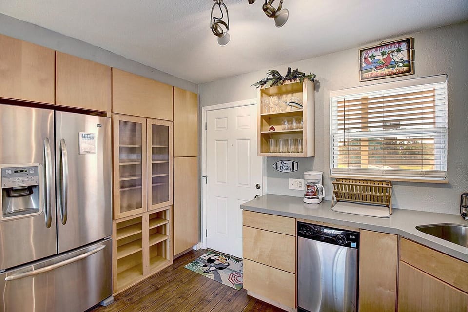 Your fully equipped kitchen features stainless steel appliances and ample storage, perfect for preparing meals during your stay.