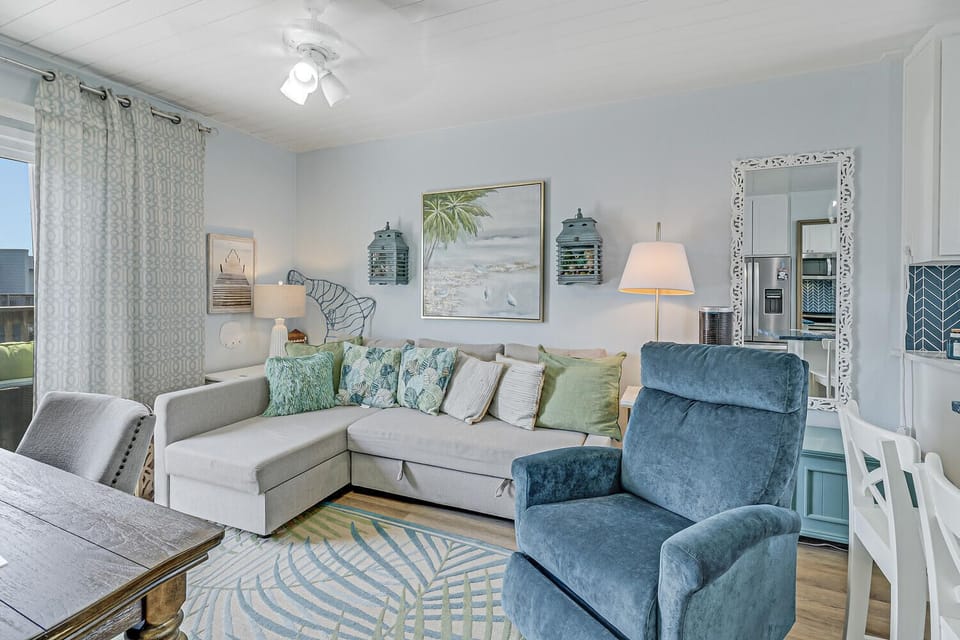Sink into plush coastal comfort where soft blues meet sea-inspired decor, creating your perfect retreat.