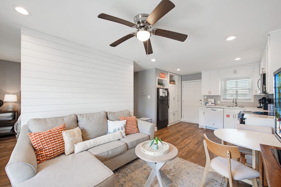 Relax in your bright, modern living space where comfort meets style with plush seating and an open kitchen design.