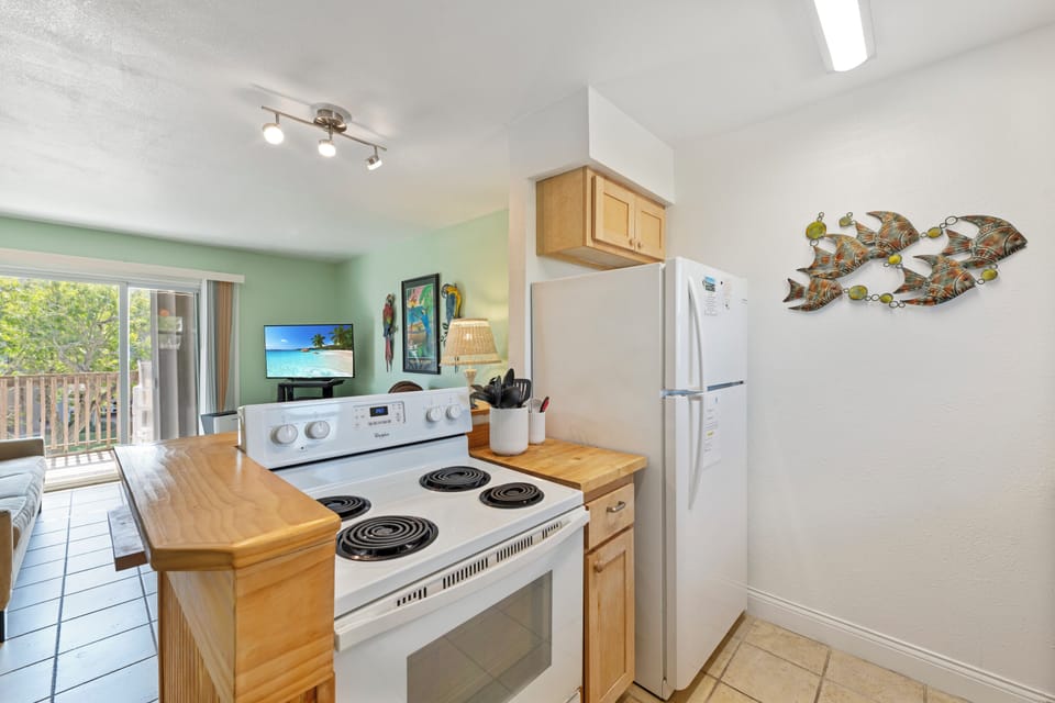 Your fully equipped kitchen awaits with everything needed to prepare meals during your coastal getaway.