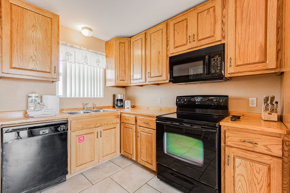 Your fully equipped kitchen features warm oak cabinets, modern appliances, and everything you need to create memorable meals during your stay.