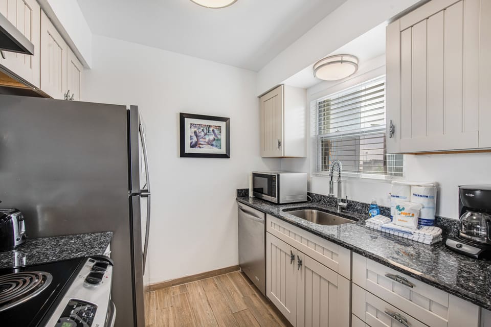 Your fully equipped kitchen features stainless steel appliances and granite countertops, perfect for preparing home-cooked meals during your stay.