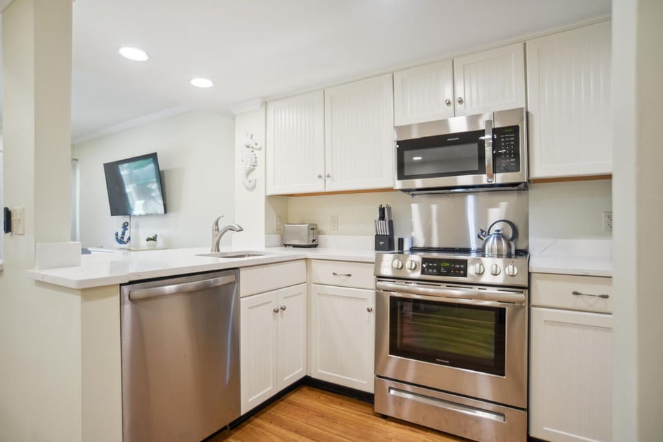 Kitchen fully stocked with cookware and dishware