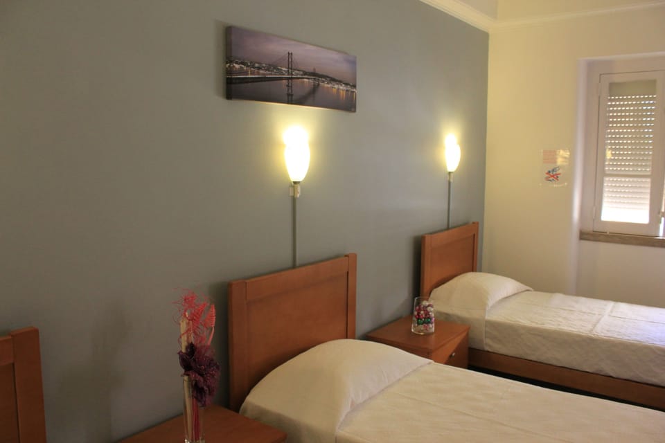 Triple Room, 3 Twin Beds | Desk, free cribs/infant beds, free WiFi, bed sheets