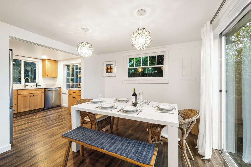 Dining room open to the living room. Sliding door to front deck.