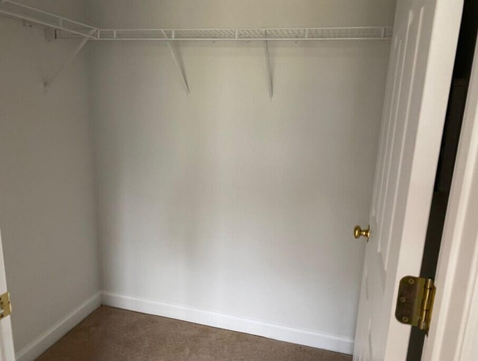 Bedroom one with walk in closet.