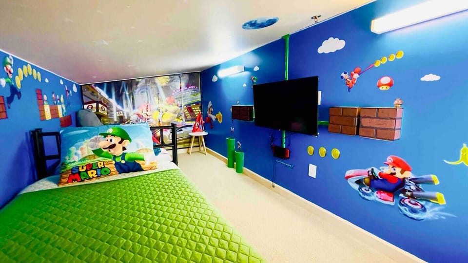 At the center of the room stands a sleek TV, perfect for gaming sessions on their very own Nintendo Switch with Mario Kart preloaded.
