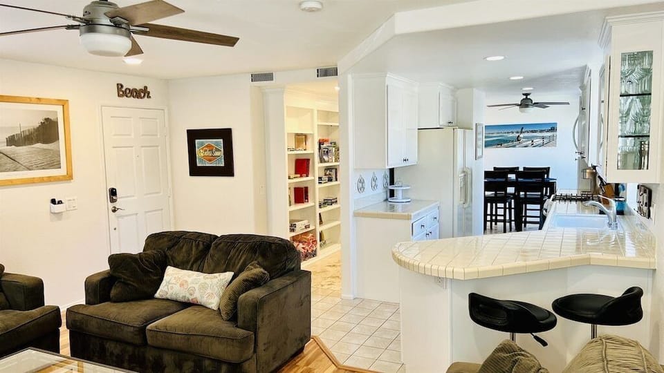 Open concept floor plan shows the living room looking into the kitchen and dining room