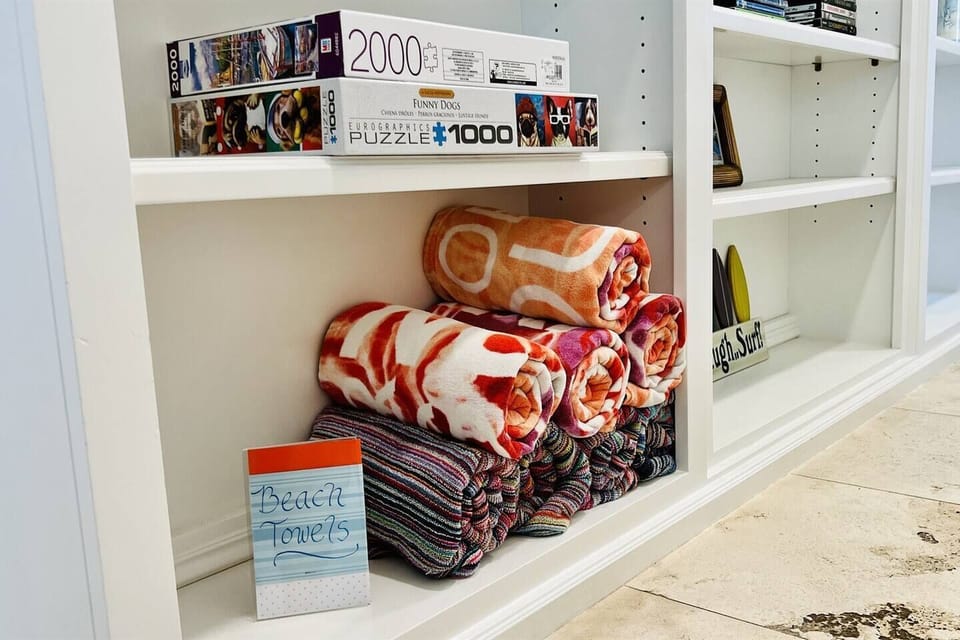 Complimentary beach towels and puzzles for guests to play
