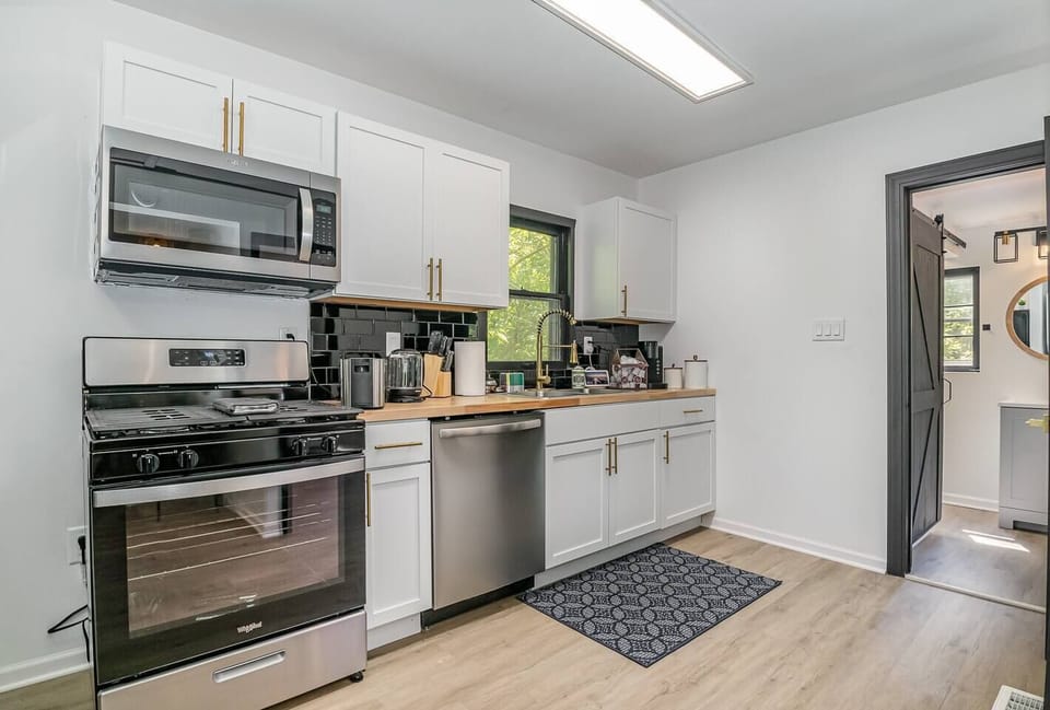 Kitchen Area with stainless steel Appliances | Microwave | | Cooking Range |