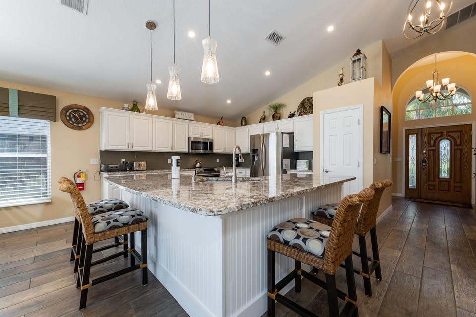 Kitchen showing breakfast bar with seating for 4