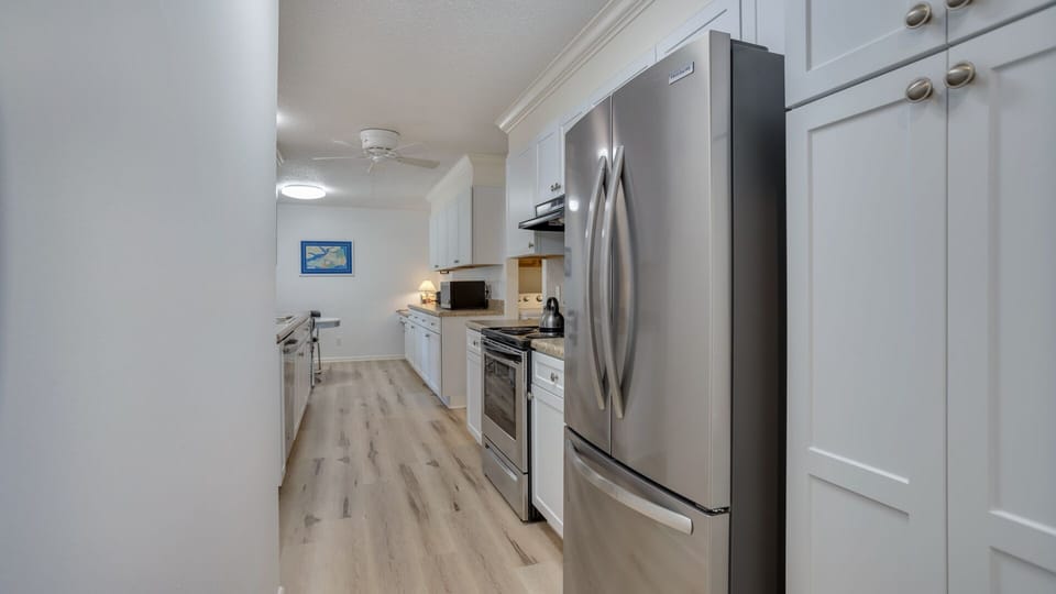 Durable flooring and ample storage make this kitchen well-suited for both everyday use and entertaining.