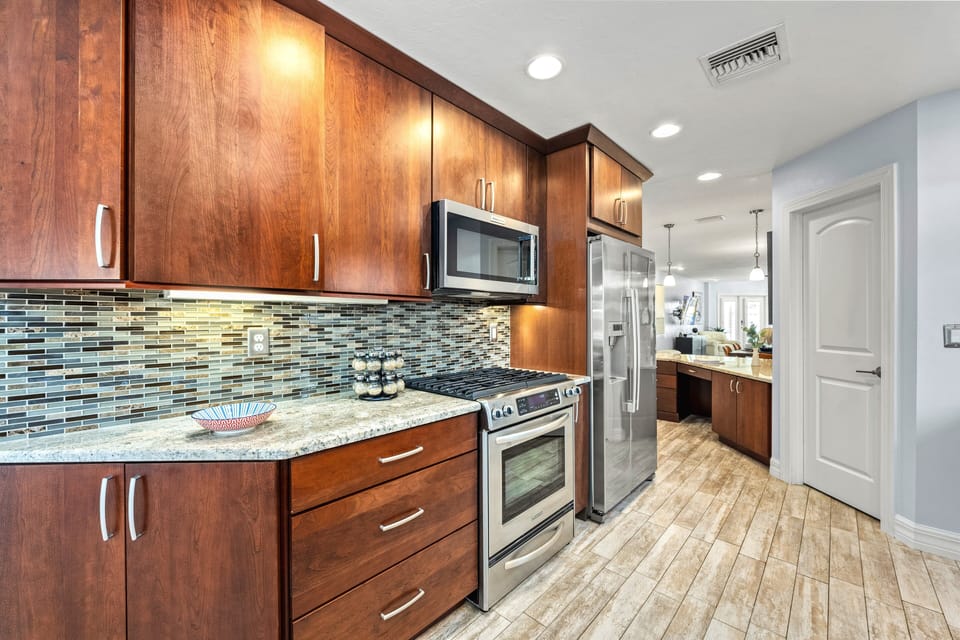 The sleek gas range invites you to cook like a chef, filling the home with aromas of fresh, flavorful meals.