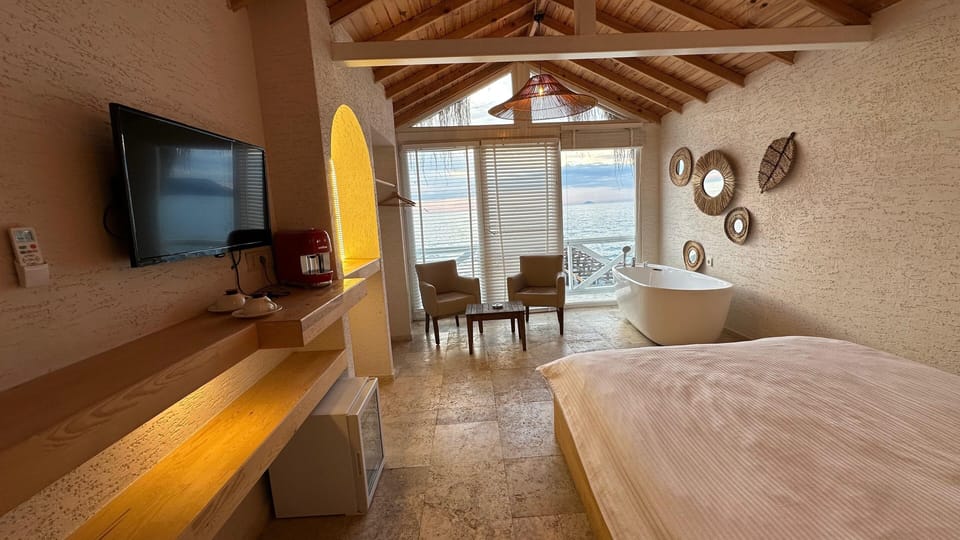 Premium Double Room, 1 Queen Bed, Bathtub, Sea View | Free minibar, individually furnished, desk, blackout drapes
