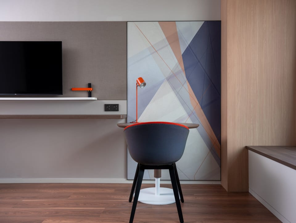 Premium bedding, desk, laptop workspace, soundproofing