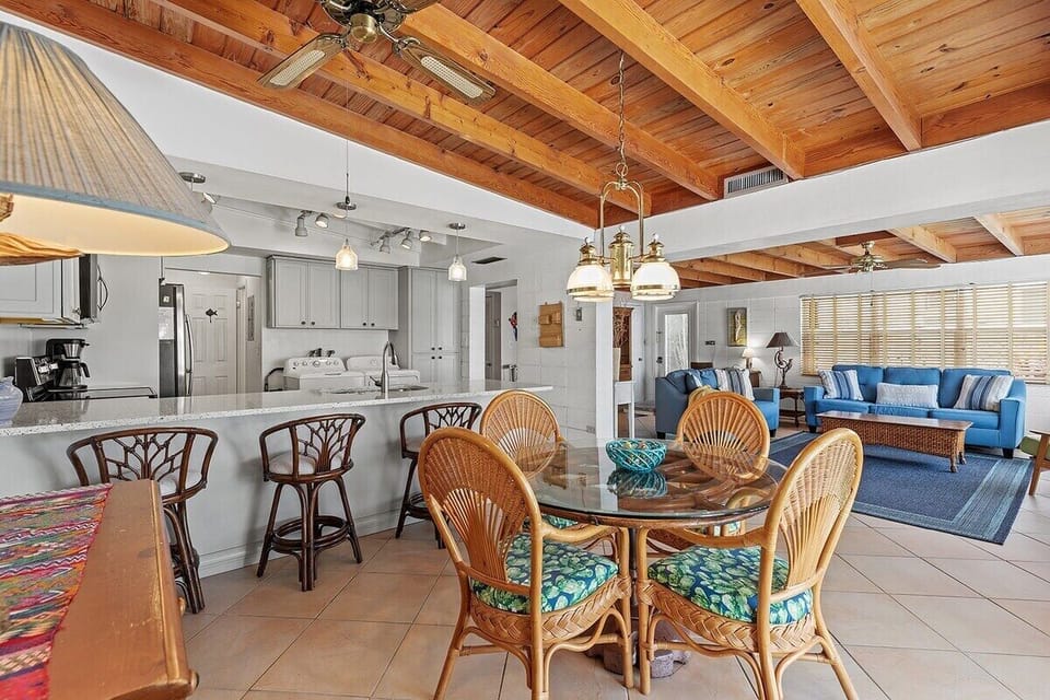 Open sightlines connect the dining room, kitchen, and living areas effortlessly.